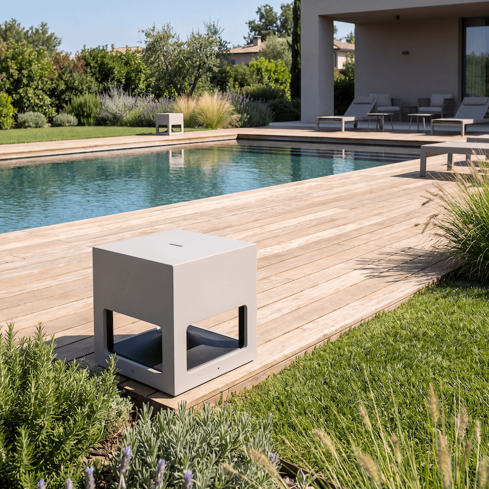 White SA117 speaker on the wooden pool deck